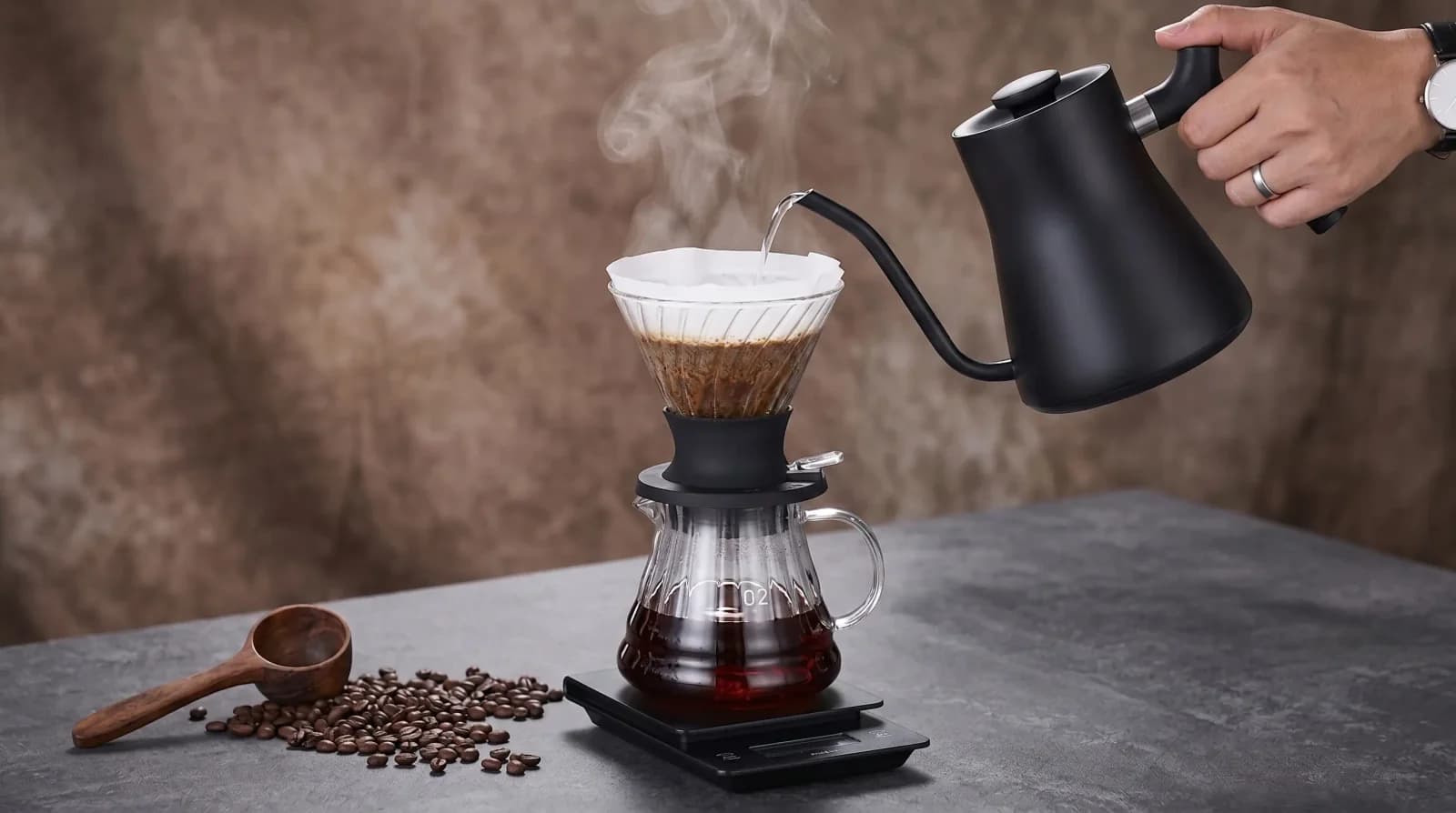 Clever perched on a mug, valve just released, first drops falling.